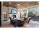 A relaxing outdoor living space features a stone fireplace, comfortable seating and covered space at 1304 Ivy Ln, Raleigh, NC 27609