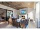 This outdoor living area with fireplace, TV and comfortable seating is perfect for entertaining at 1304 Ivy Ln, Raleigh, NC 27609
