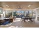 Outdoor living space with dual areas, including living room set, dining area and retractable screens at 1304 Ivy Ln, Raleigh, NC 27609