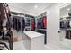 Large walk-in closet with island and plenty of storage at 1304 Ivy Ln, Raleigh, NC 27609