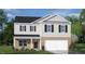 Two-story house with brick and siding, two-car garage, and landscaping at 145 Scenic Rock Dr, Youngsville, NC 27596