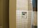 Tiled shower features a built-in storage niche at 1587 Crockers Nub Rd, Middlesex, NC 27557