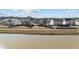 Aerial view of homes near a lake at 2120 Blue Iris Way, Zebulon, NC 27597