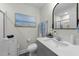 Clean bathroom with vanity, toilet, and beach-themed art at 2120 Blue Iris Way, Zebulon, NC 27597