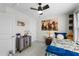 Cozy bedroom with twin bed, ceiling fan, and decorative art at 2120 Blue Iris Way, Zebulon, NC 27597