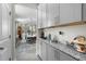 Gray cabinets and granite countertops in a butlers pantry at 2120 Blue Iris Way, Zebulon, NC 27597