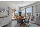 Bright dining area with wooden table and chairs, overlooking a patio at 2120 Blue Iris Way, Zebulon, NC 27597