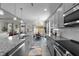Spacious kitchen featuring granite countertops and stainless steel appliances at 2120 Blue Iris Way, Zebulon, NC 27597
