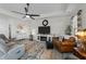 Spacious living room, featuring a ceiling fan and comfortable seating at 2120 Blue Iris Way, Zebulon, NC 27597