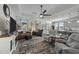 Open concept living room with comfortable seating and kitchen views at 2120 Blue Iris Way, Zebulon, NC 27597