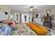 Main bedroom with king-size bed and en-suite bathroom access at 2120 Blue Iris Way, Zebulon, NC 27597