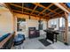 Backyard patio with multiple grills and seating at 2120 Blue Iris Way, Zebulon, NC 27597
