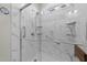 Large walk-in shower with marble surround and multiple shower heads at 2120 Blue Iris Way, Zebulon, NC 27597