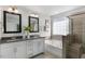 Double vanity bathroom with walk-in shower at 2332 Sugar Cone Way, Fuquay Varina, NC 27526