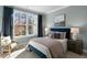 Bedroom with large window, plush bedding, and neutral decor at 2332 Sugar Cone Way, Fuquay Varina, NC 27526