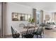 Dining area with a white table, black chairs, and a large mirror at 2332 Sugar Cone Way, Fuquay Varina, NC 27526