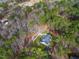 Aerial view of the property, highlighting its secluded location in the woods at 257 Rawhide Dr, Louisburg, NC 27549