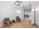 Bright foyer with hardwood floors and mid-century modern armchairs at 257 Rawhide Dr, Louisburg, NC 27549