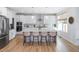 Modern kitchen features a large island with seating and granite countertops at 257 Rawhide Dr, Louisburg, NC 27549