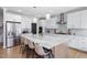 Spacious kitchen boasts a large island, stainless steel appliances, and white cabinets at 257 Rawhide Dr, Louisburg, NC 27549