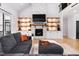 Spacious living room with a stone fireplace and built-in shelving at 257 Rawhide Dr, Louisburg, NC 27549