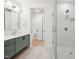 Spa-like bathroom with sleek vanity, glass shower and modern finishes at 29 Enterprise St # 107, Raleigh, NC 27607