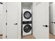 Convenient laundry area features a stacked washer and dryer at 29 Enterprise St # 107, Raleigh, NC 27607