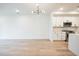 Bright living space with hardwood floors flowing into an open kitchen area at 29 Enterprise St # 107, Raleigh, NC 27607
