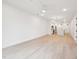 Spacious living area with hardwood floors that transition to an open kitchen and dining space at 29 Enterprise St # 107, Raleigh, NC 27607