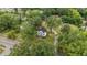 Aerial view showing a two-story white house with a large yard and surrounding trees at 309 Hawkins Ave, Sanford, NC 27330