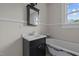 Charming bathroom with pedestal sink, clawfoot tub, and vintage details at 309 Hawkins Ave, Sanford, NC 27330