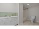 Simple bathroom with shower/tub combo and white vanity at 309 Hawkins Ave, Sanford, NC 27330