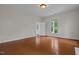 Spacious bedroom with hardwood floors and large windows at 309 Hawkins Ave, Sanford, NC 27330