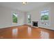 Spacious bedroom with hardwood floors, fireplace and large windows at 309 Hawkins Ave, Sanford, NC 27330