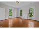 Large bedroom with hardwood floors, fireplace and large windows at 309 Hawkins Ave, Sanford, NC 27330