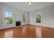 Bright bedroom with hardwood floors, fireplace and large windows at 309 Hawkins Ave, Sanford, NC 27330
