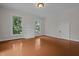 Spacious bedroom with hardwood floors, fireplace and large windows at 309 Hawkins Ave, Sanford, NC 27330