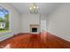 Bright dining room featuring hardwood floors and a fireplace at 309 Hawkins Ave, Sanford, NC 27330