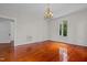 Bright dining room with hardwood floors and chandelier at 309 Hawkins Ave, Sanford, NC 27330