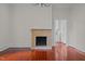 Spacious dining room with hardwood floors and a brick fireplace at 309 Hawkins Ave, Sanford, NC 27330