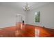 Dining room with hardwood floors, chandelier, and view into living room at 309 Hawkins Ave, Sanford, NC 27330