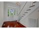 Foyer with hardwood floors, staircase, and front door at 309 Hawkins Ave, Sanford, NC 27330