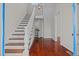 Bright foyer with hardwood floors and elegant staircase at 309 Hawkins Ave, Sanford, NC 27330