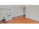 Kitchen features white appliances and wood flooring at 309 Hawkins Ave, Sanford, NC 27330