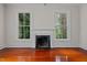 Living room with hardwood floors and fireplace at 309 Hawkins Ave, Sanford, NC 27330