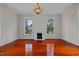 Spacious living room with hardwood floors, fireplace and chandelier at 309 Hawkins Ave, Sanford, NC 27330