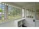 Inviting screened porch with built-in bench seating at 309 Hawkins Ave, Sanford, NC 27330