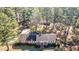 Ranch house on a wooded lot with additional structures at 3129 Barwell Rd Rd, Raleigh, NC 27610