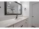 Modern bathroom vanity with quartz countertop and black fixtures at 3129 Barwell Rd Rd, Raleigh, NC 27610