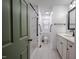 Bright bathroom featuring a spacious shower with white marble-style tile and modern fixtures at 3129 Barwell Rd Rd, Raleigh, NC 27610